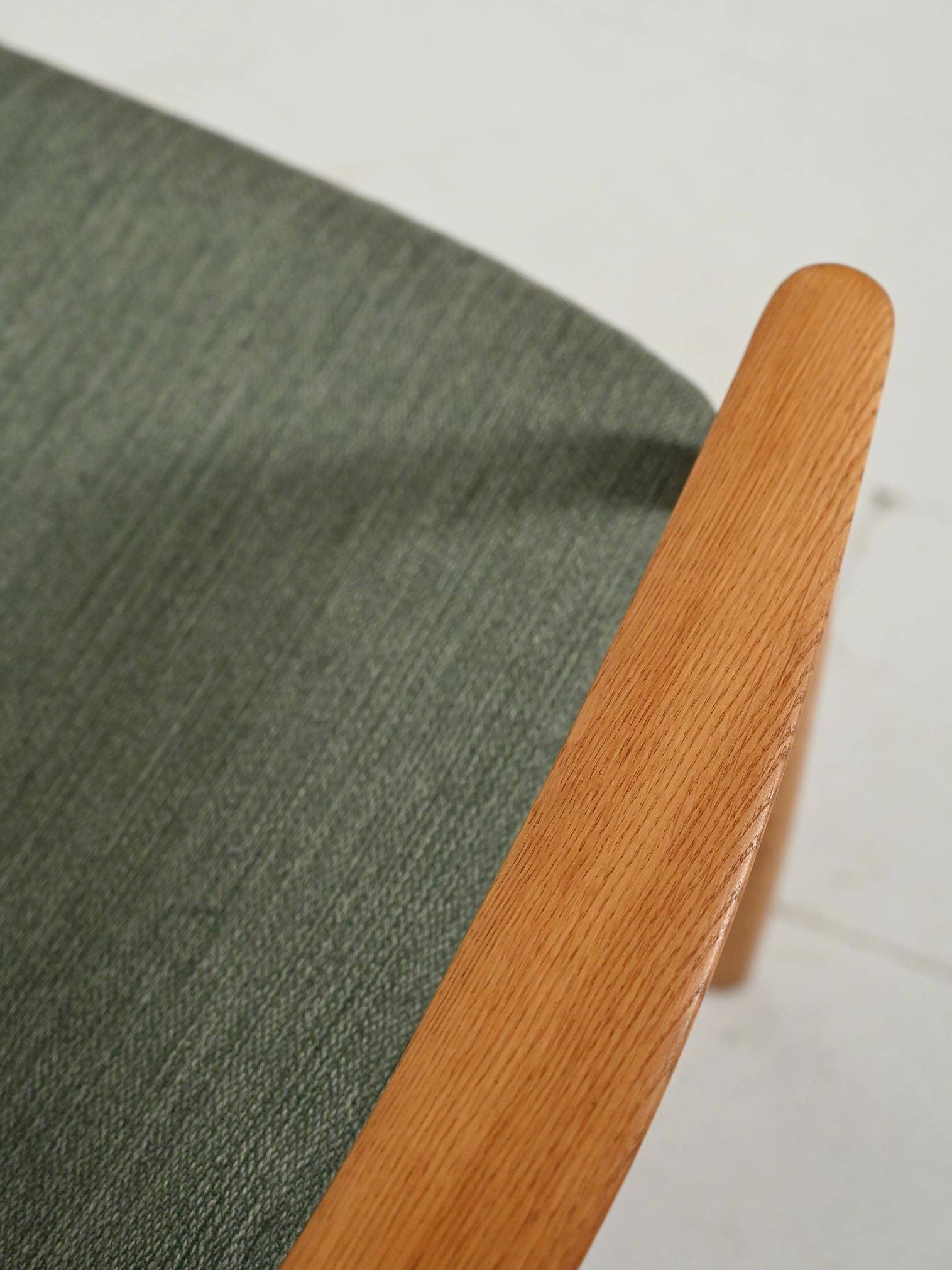Scandinavian oak and sage-green wool armchair