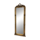 French palace mirror with bow and lion heads, gilded frame.