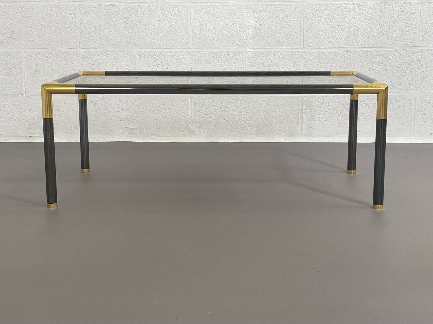 Gunmetal gold metal and smoked glass coffee table from the 70s