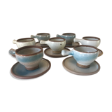 Lot 7 cups and saucers sandstone by Roger Jacques