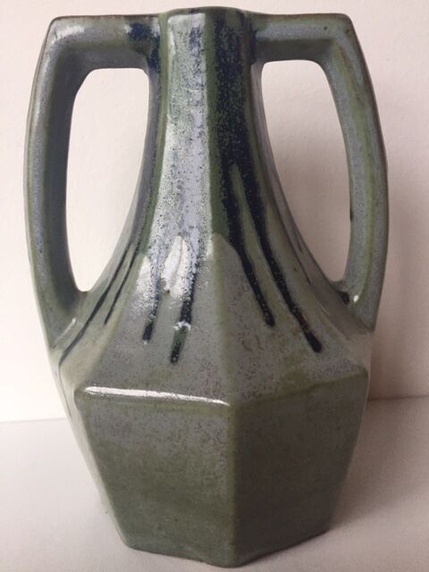 Ancient amphora vase in sand