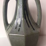 Ancient amphora vase in sand