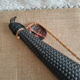 Glass bottle covered with black scoubidou with twisted golden handle - vintage