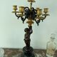 Candelabra with cherub in patinated bronze