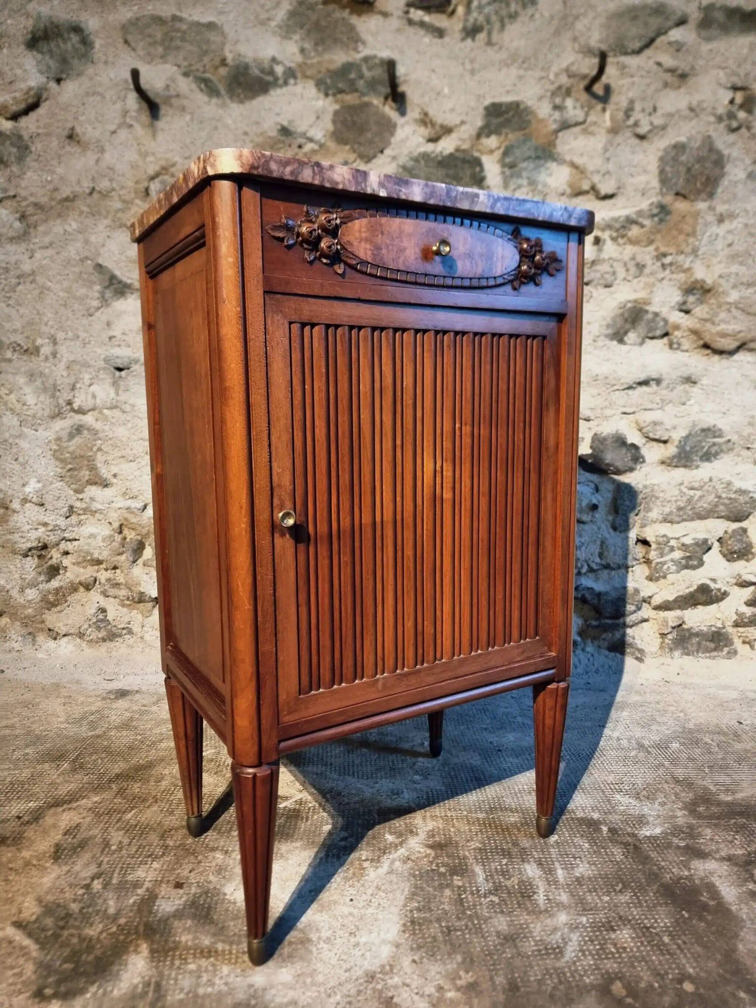 French antique bedside table in walnut with a marble top and porcelain interior, early 20th century.