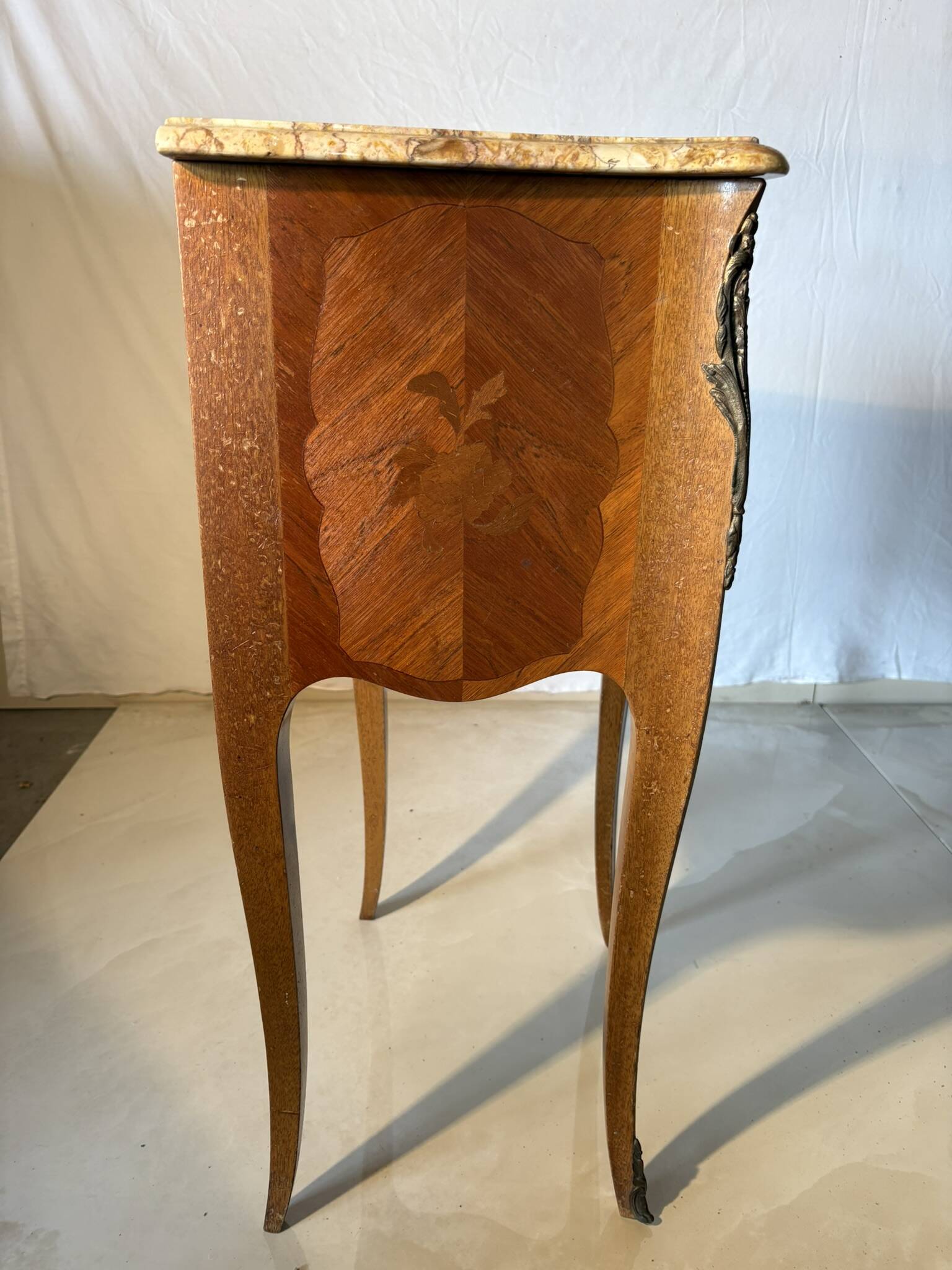 Small curved Louis XV style piece of furniture – marquetry and marble top