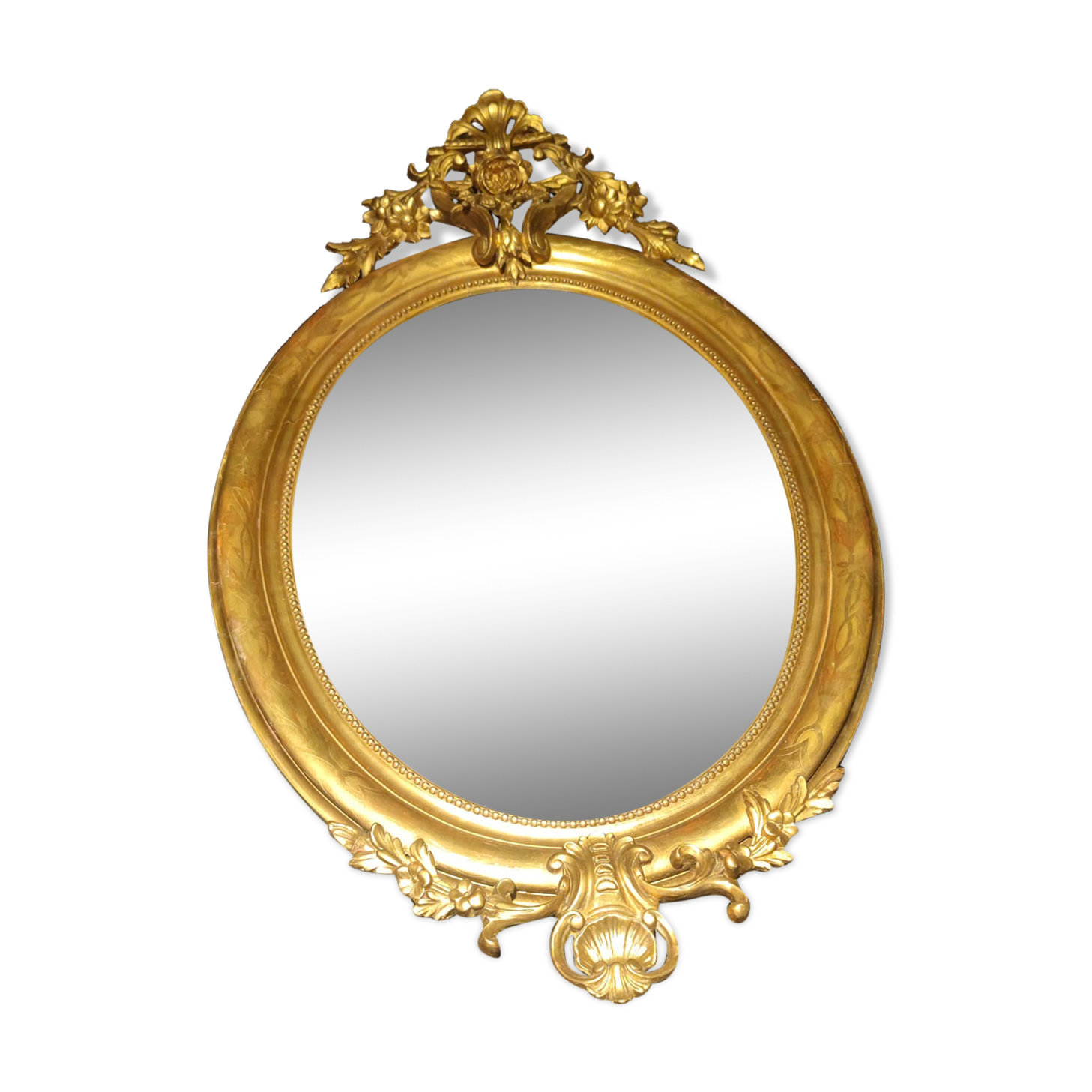 Ovoid mirror with double gilt pediments, circa 1830, 105x66 cm