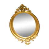 Ovoid mirror with double pediments gilded with leaf circa 1830, 105x66 cm
