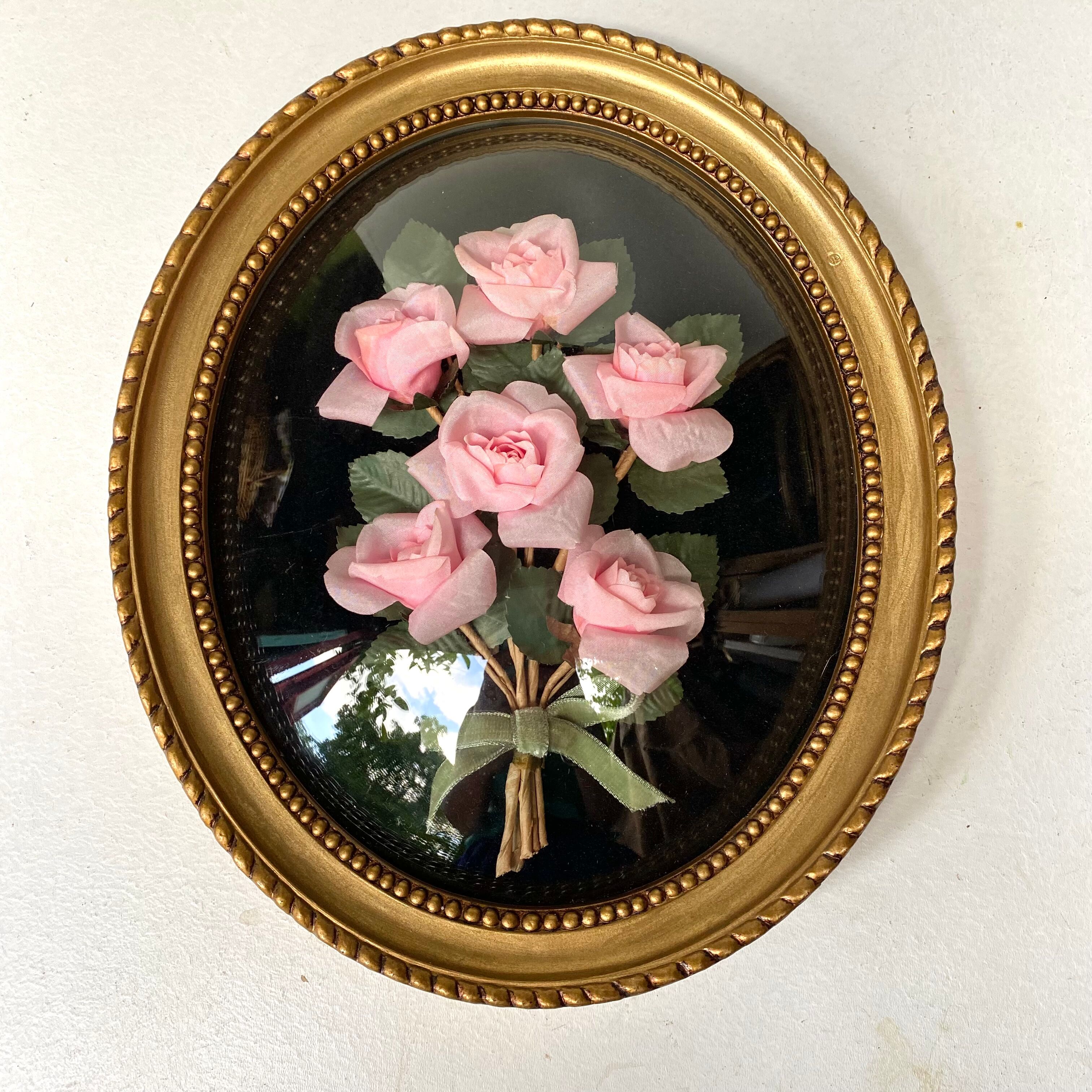 Oval frame domed glass curved roses