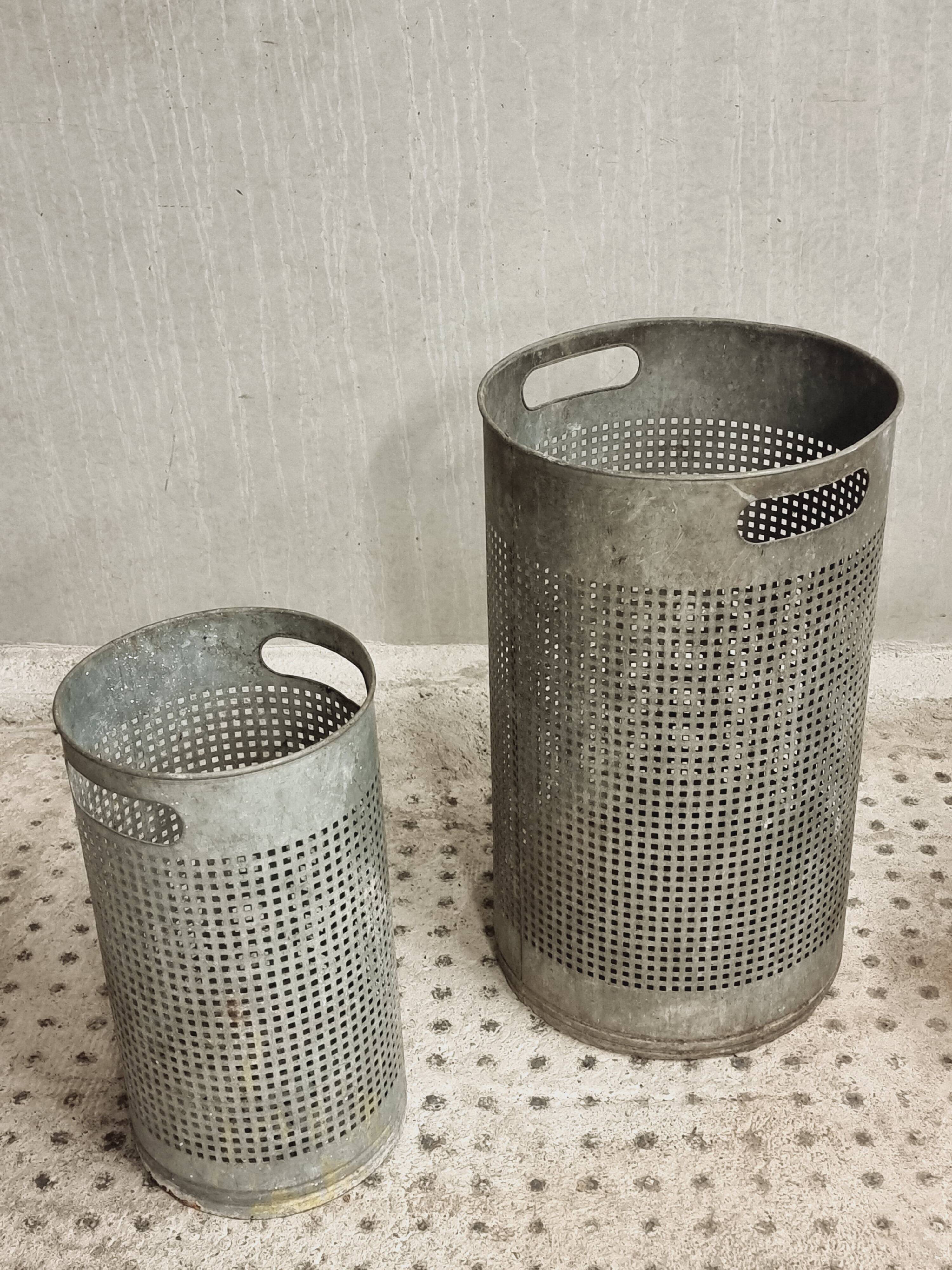 Vintage set of perforated metal waste bins