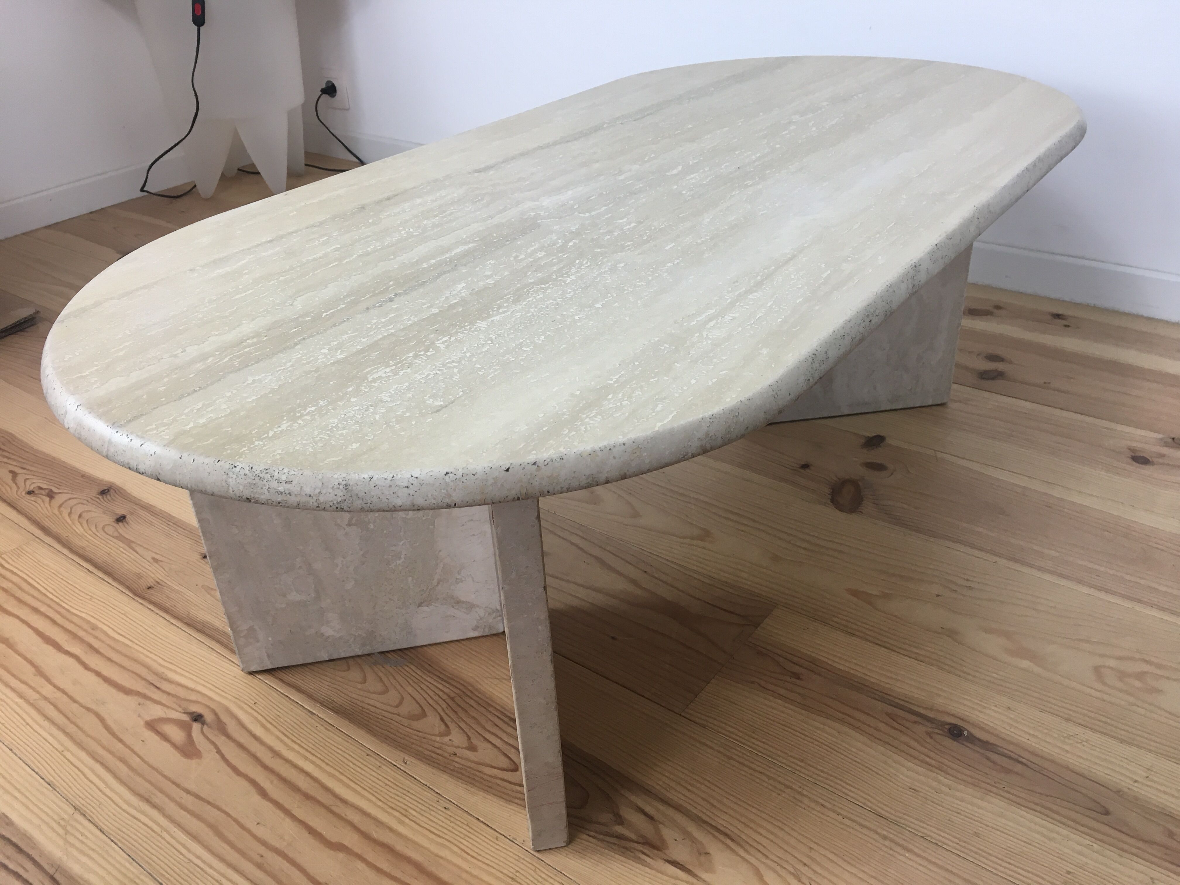 Oval coffee table in travertine