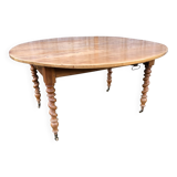 Round table in solid cherry wood, extendable with twisted legs, Louis Philippe style.