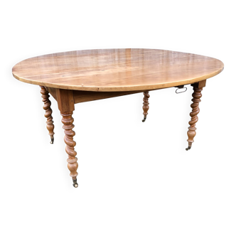 Round table in solid cherry wood, extendable with twisted legs, Louis Philippe style.