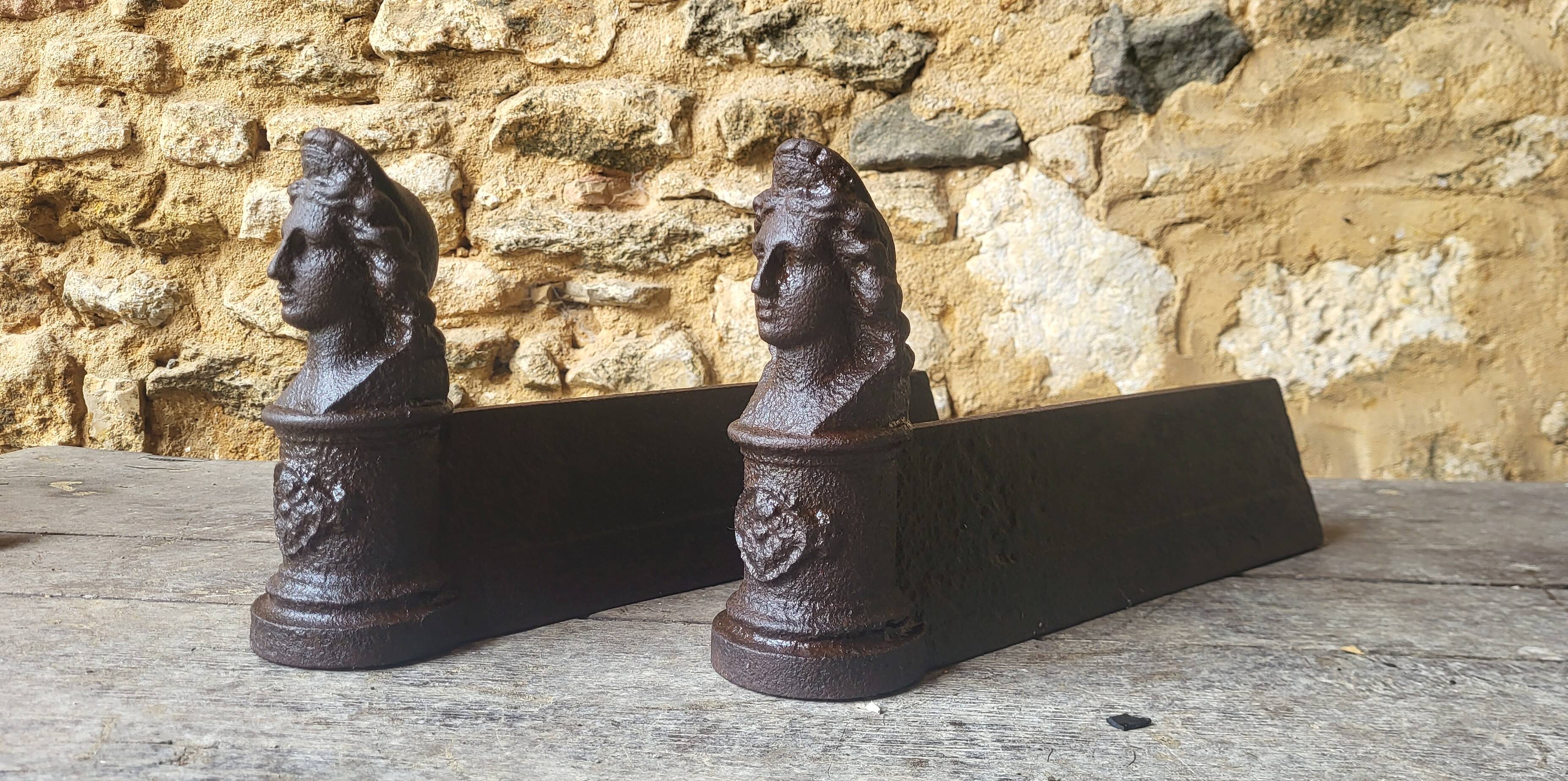 Pair of cast iron andirons from the 19th century