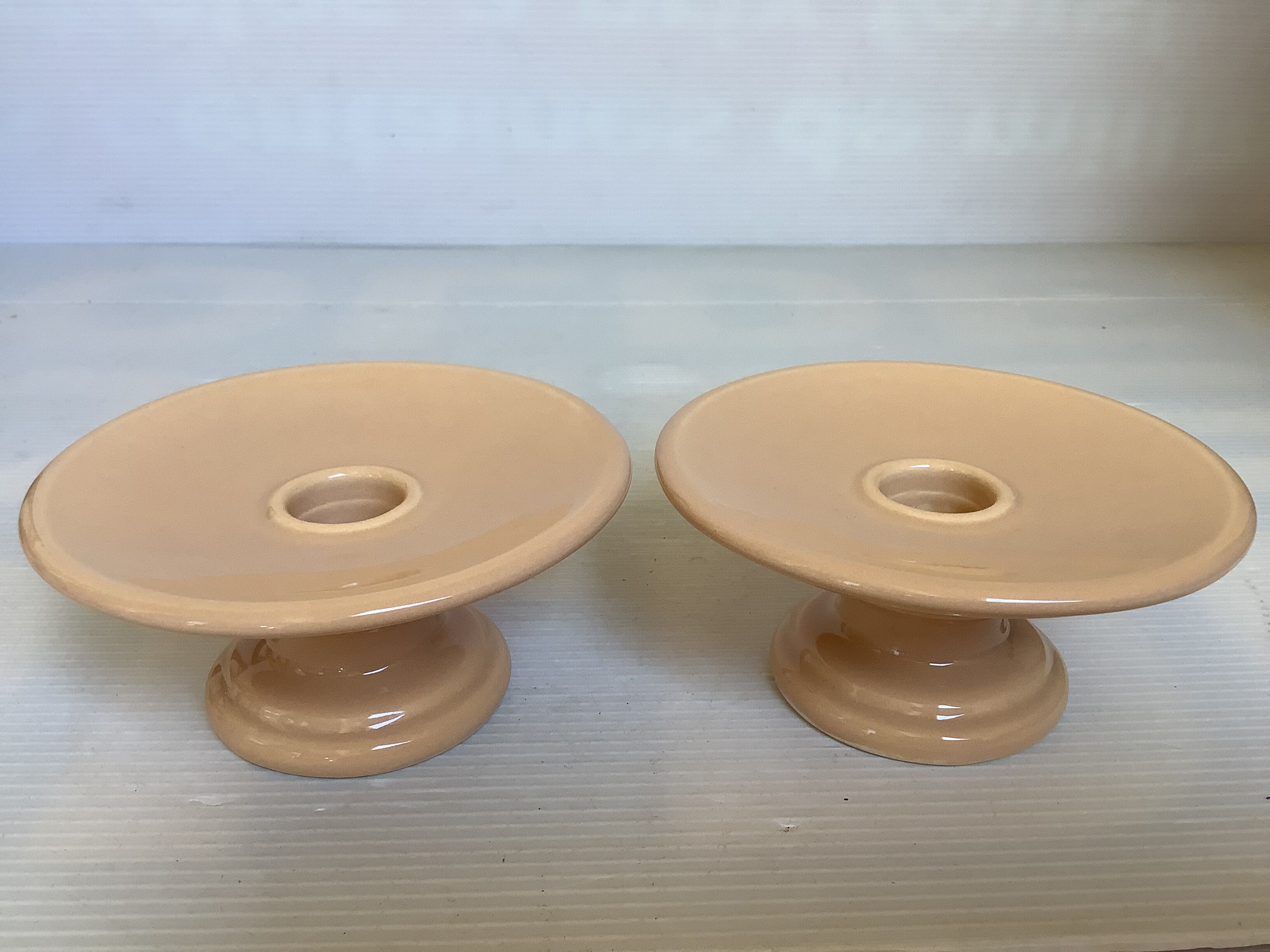 Pair of beige candlesticks