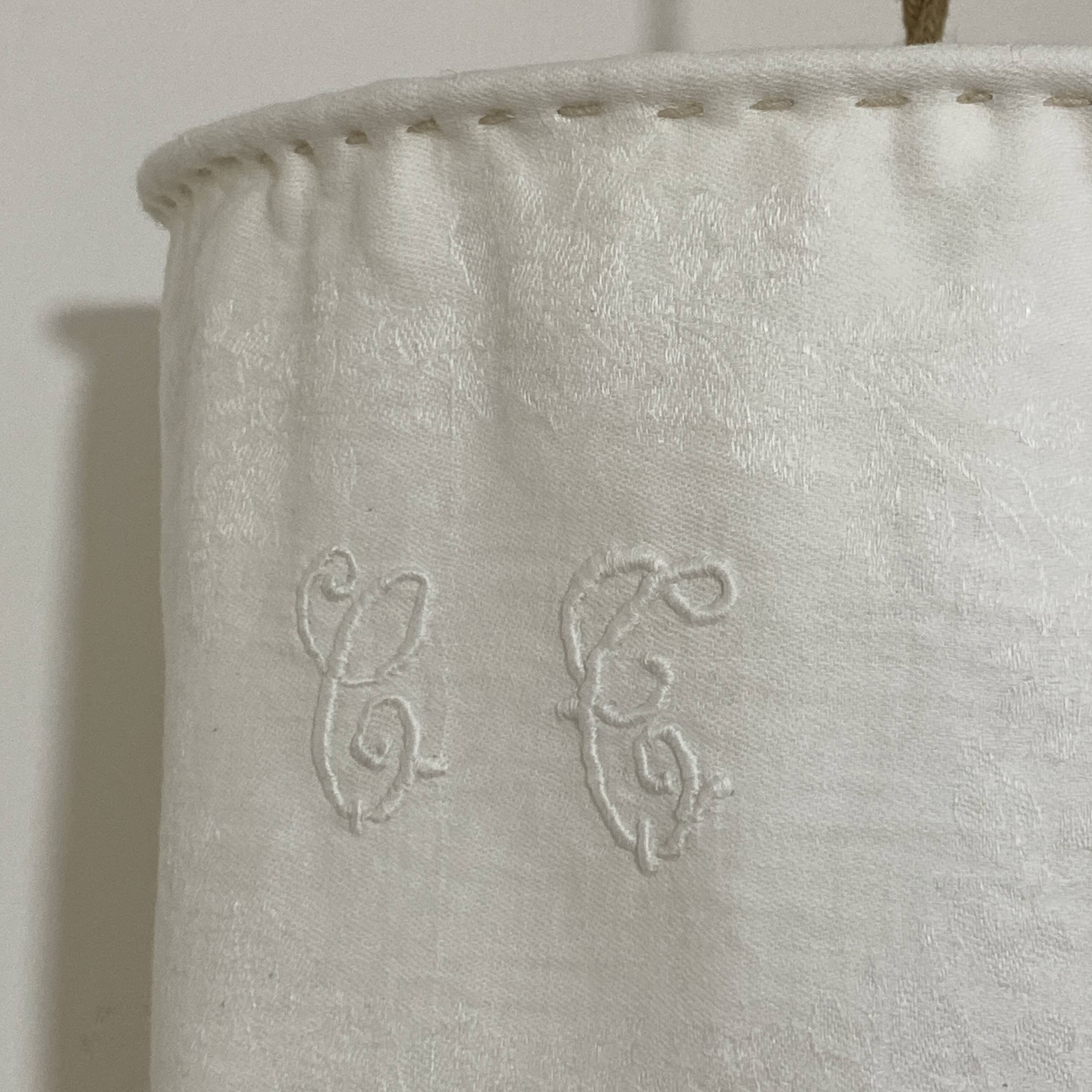 Old linen drapery with monogram and bird by Georges Braque