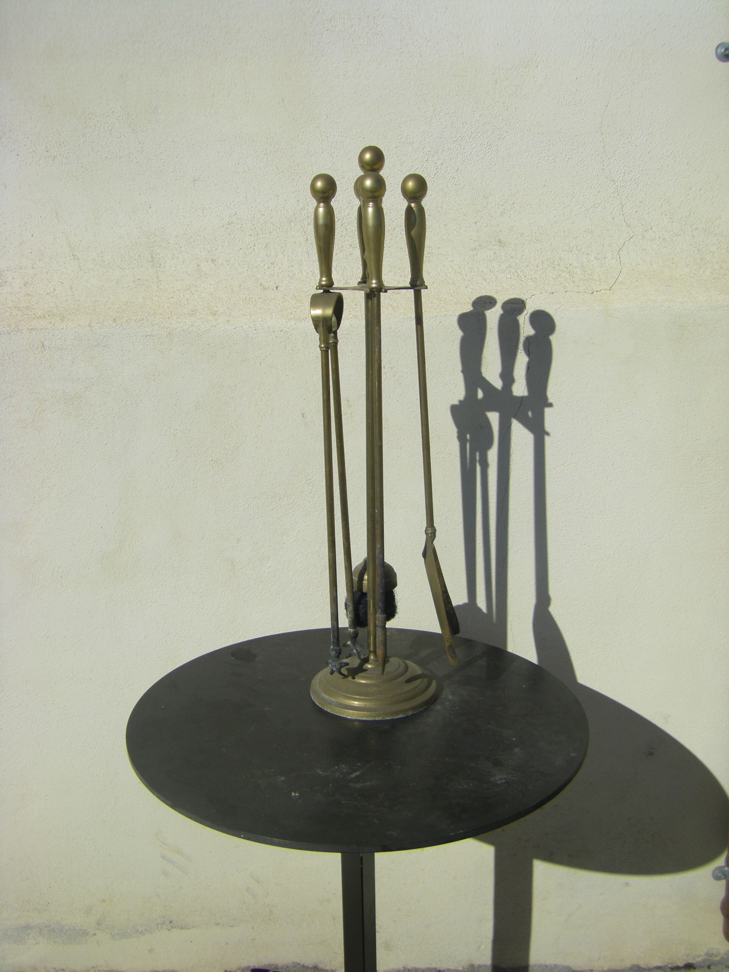 Gilded brass fireplace servant.