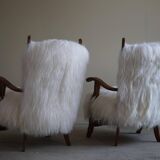 Pair of Scandinavian armchairs in oak and long-haired Icelandic sheepskin by Henning Kjærnulf, 1950.