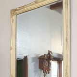 Beveled mirror in carved wood