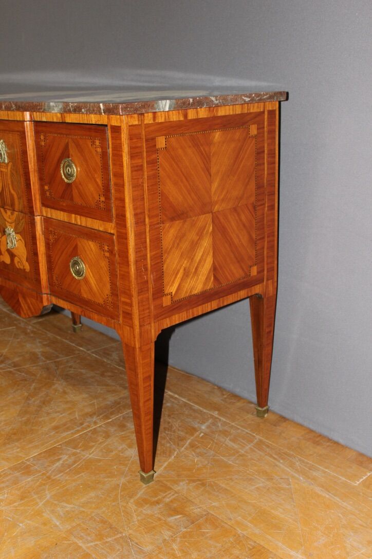 Louis XVI style chest of drawers with music attributes