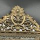 Small mirror with brass parcloses in repoussé style Louis XIV, late 19th century.