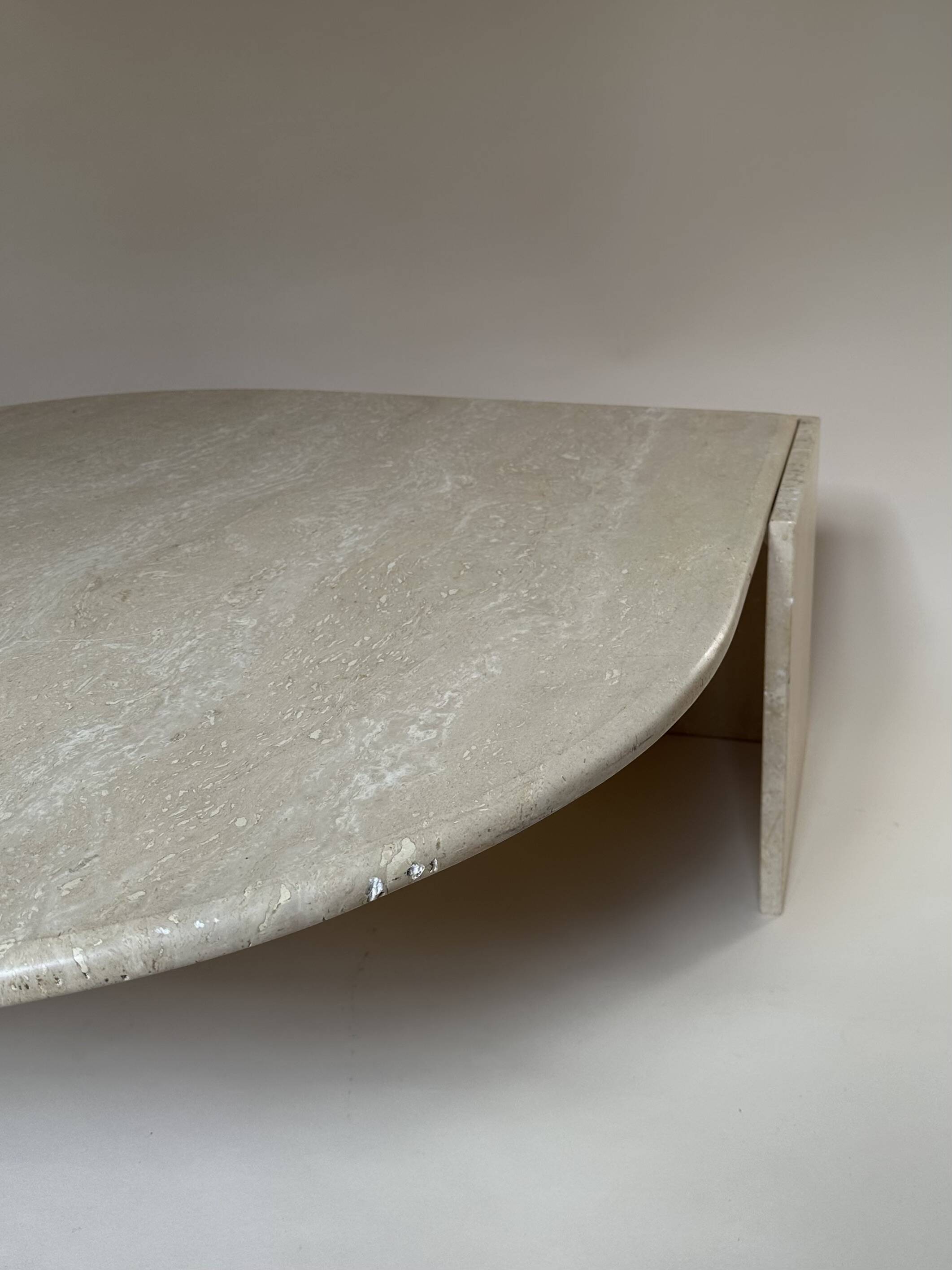 Travertine eye-shaped coffee table