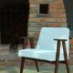 Scandinavian boucle armchair in snow white with dark walnut wood colour, designed by Chierowski, model 366.