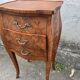 Pair of bedside tables with bombé shape, marquetry, and bronze in Louis XV style.