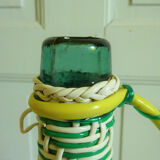 Green and white scoubidou bottle