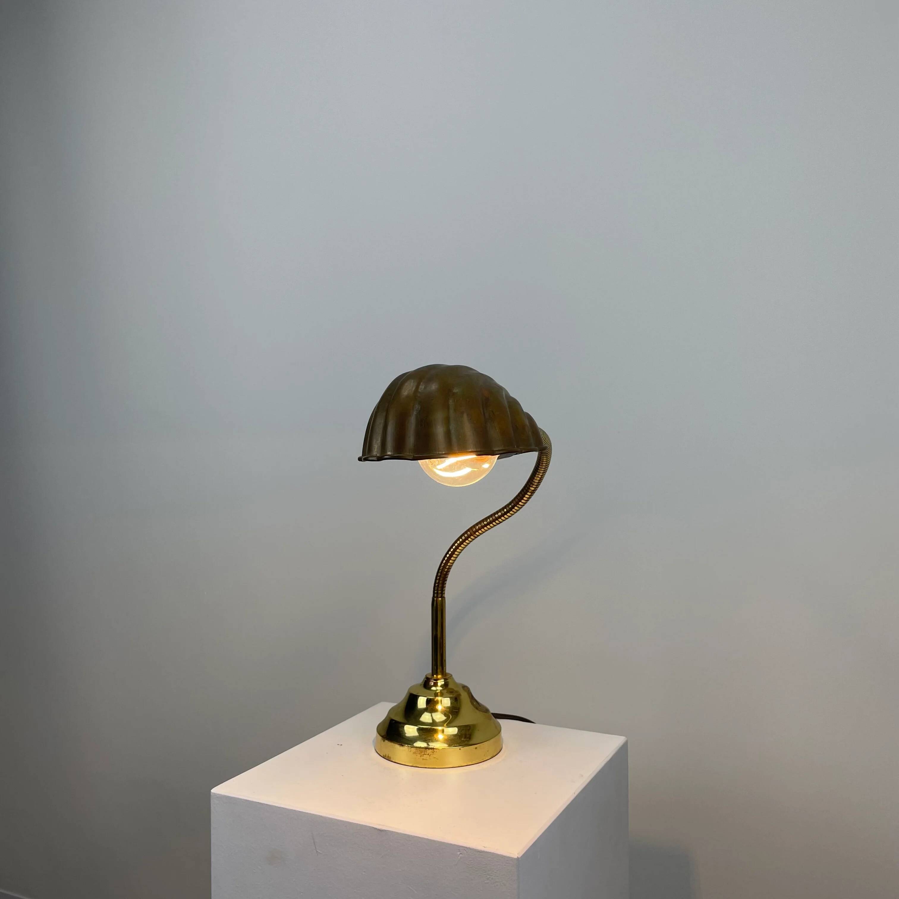 French table lamp in brass with a shell-shaped shade from the 1950s.