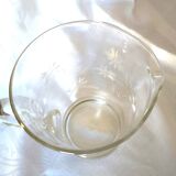 Blown glass pitcher decorated with small flowers