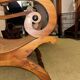 Colonial planter's armchair in solid teak, scroll armrests, caned seat.