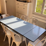Blue Formica table for 4 to 6 people