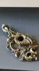 Antique Baroque/Rocaille style hand candle holder. In bronze with an old gold patina.