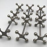 Set of 6 old table knife resistors in the shape of crossbars in silver metal