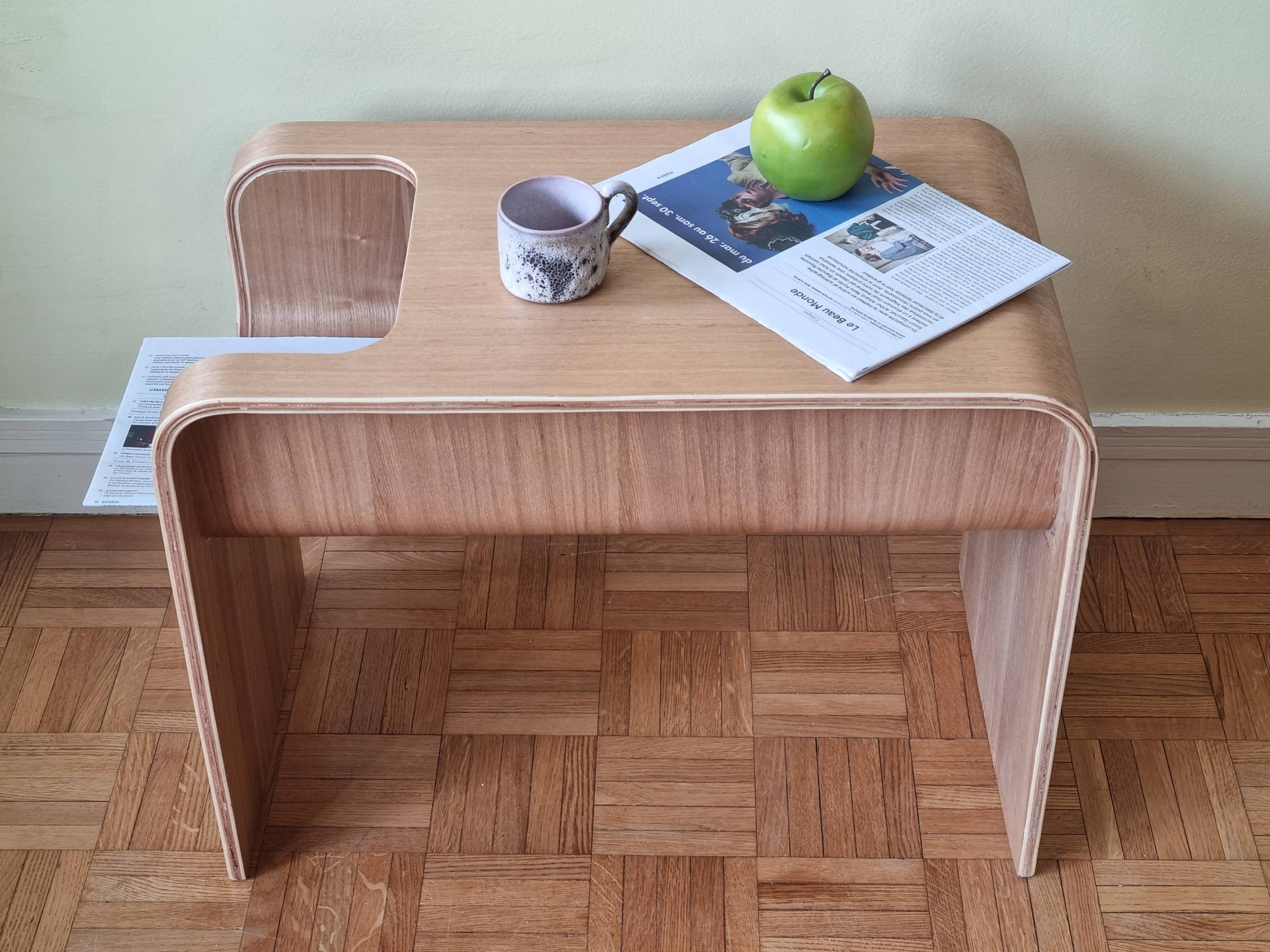 Boone coffee table in curved wood produced by Habitat, design