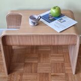 Boone coffee table in curved wood produced by Habitat, design