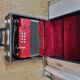 Red Aidi R accordion in his suitcase