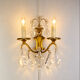 Bronze wall light with rococo style Louis XV pendants.
