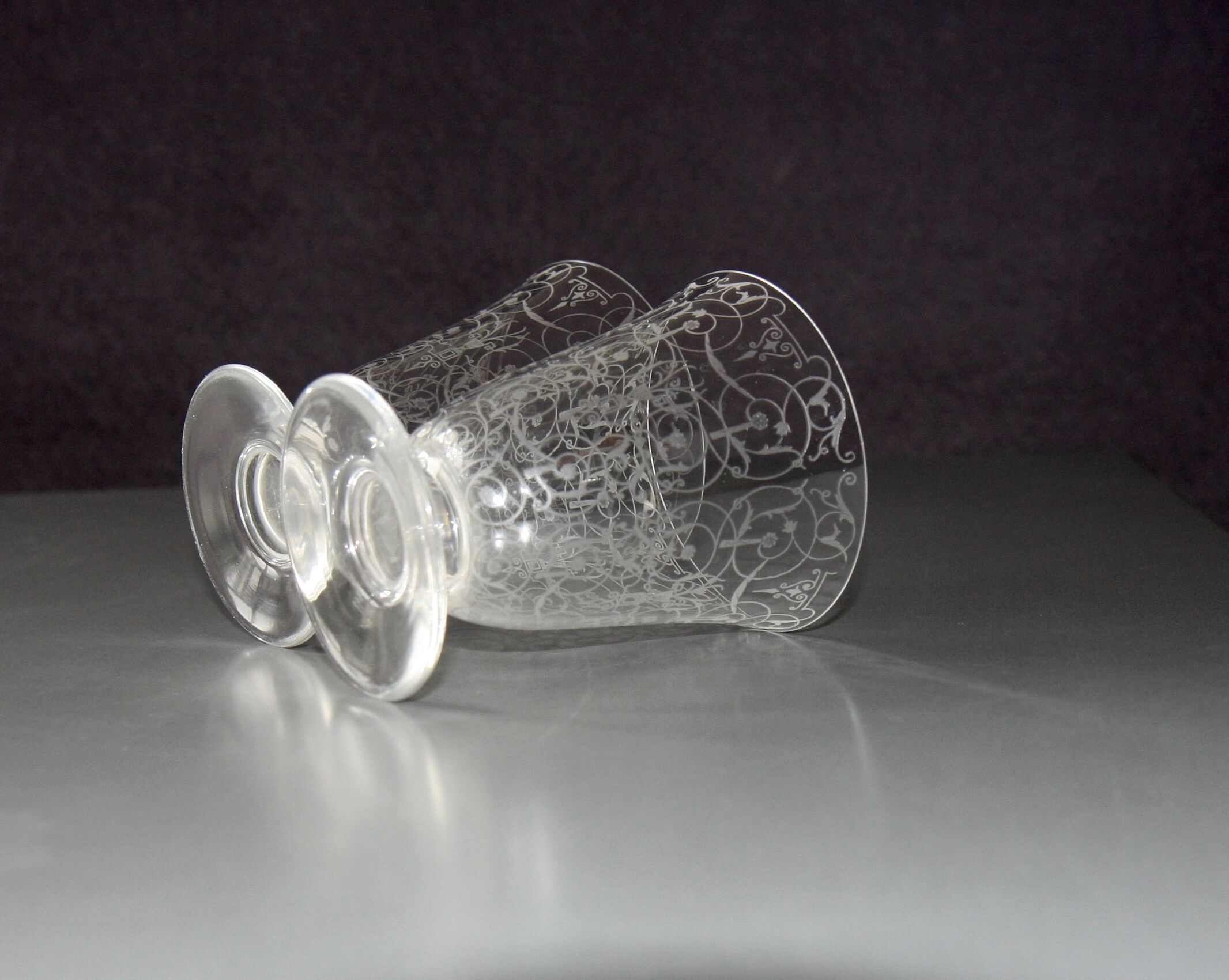Two Baccarat glasses model "Michelangelo" in engraved crystal.