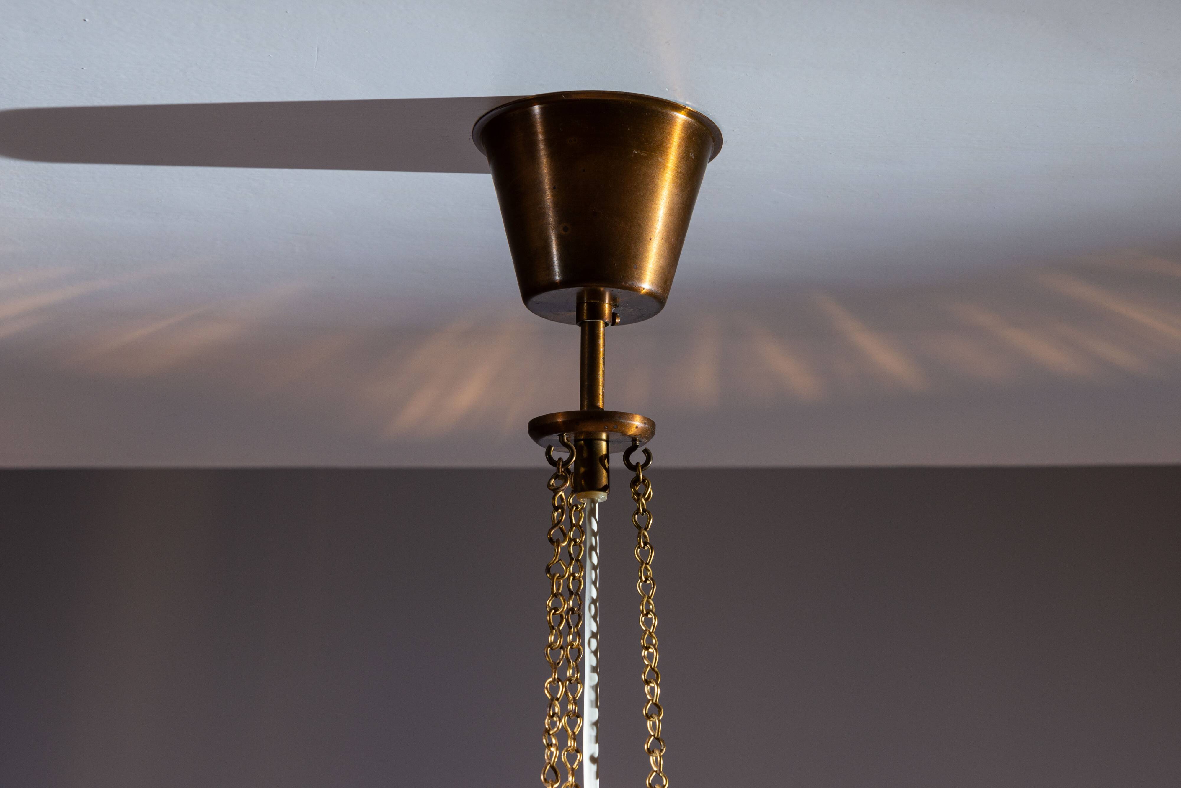 Swedish pendant with glass leaf shades and a center shade of amber coloured
