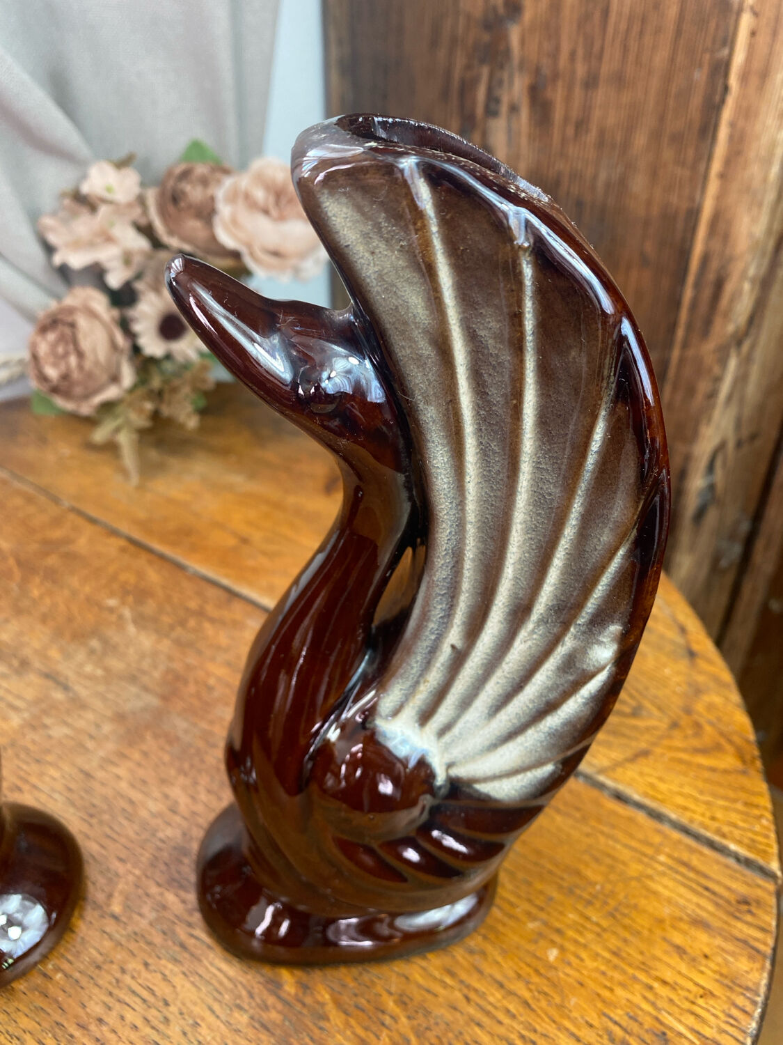 Pair of ceramic vases in the shape of swans.