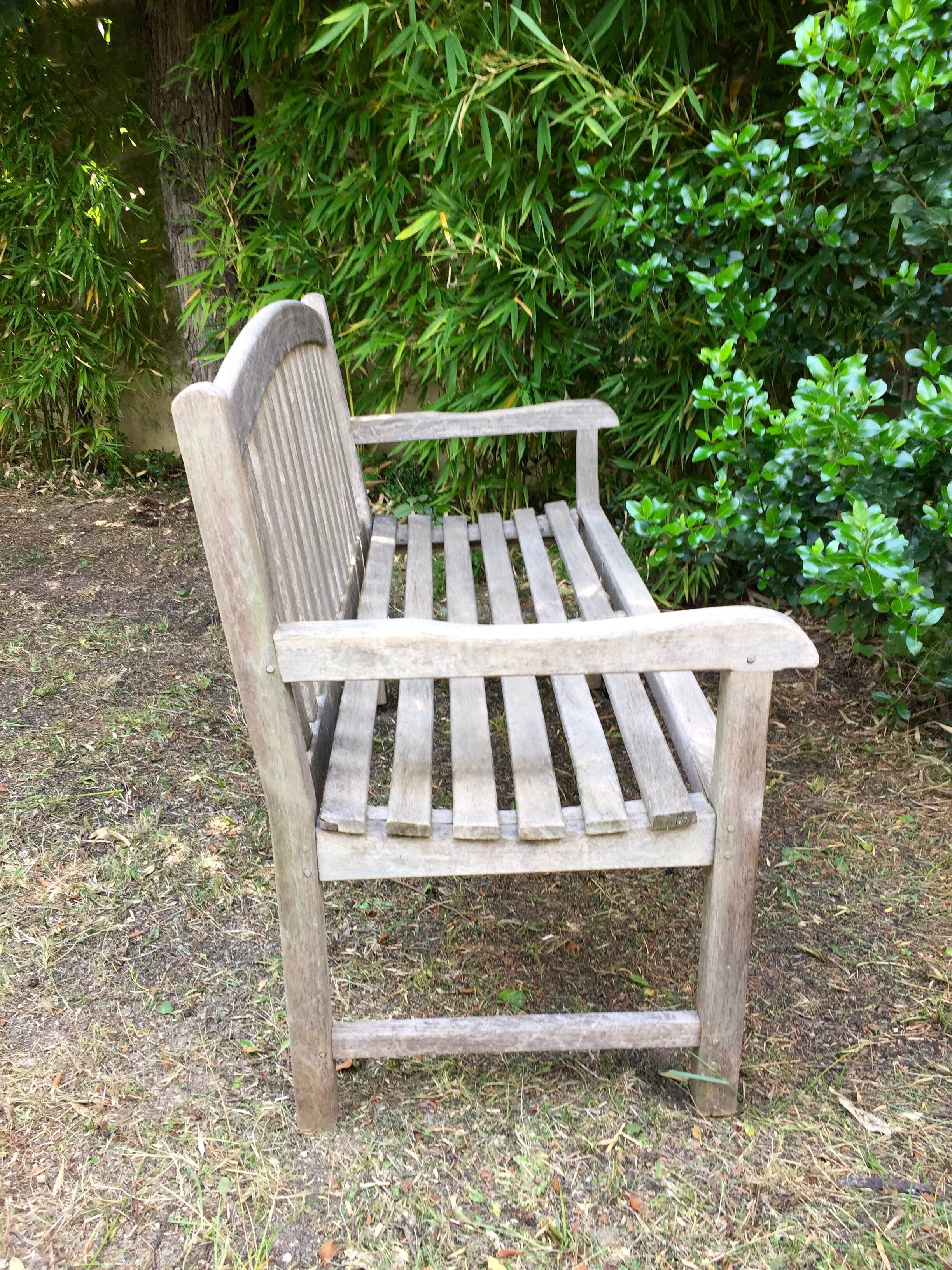 Vintage wooden garden bench with wheels