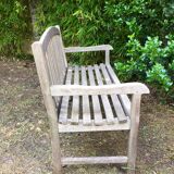 Vintage wooden garden bench with wheels