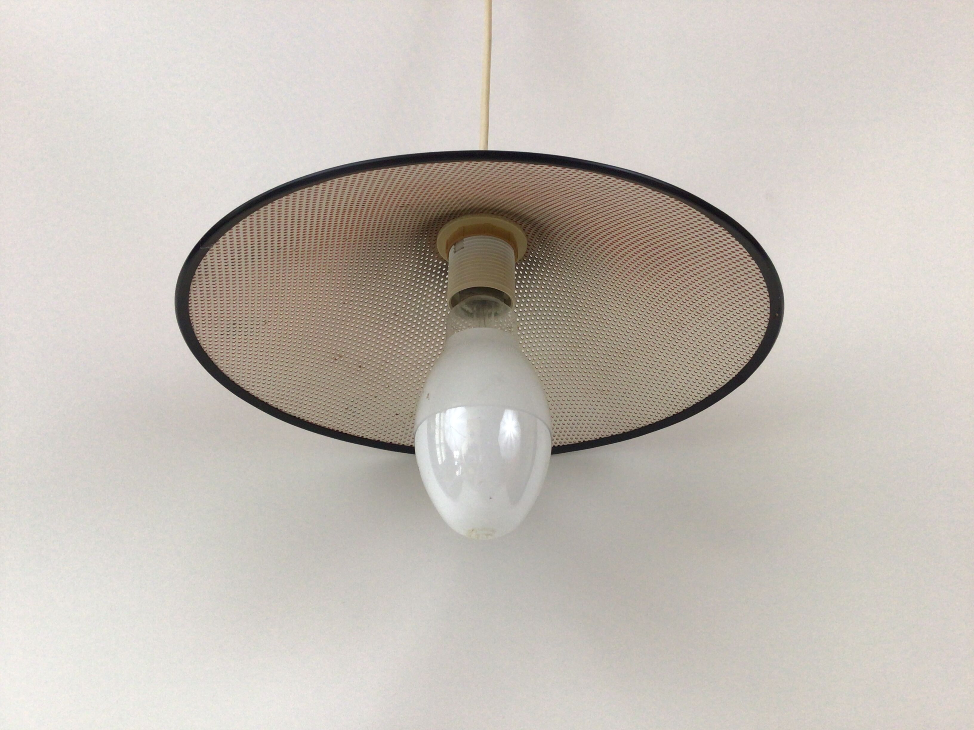 Perforated metal suspension