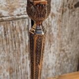 Pair of chiseled metal candle holders