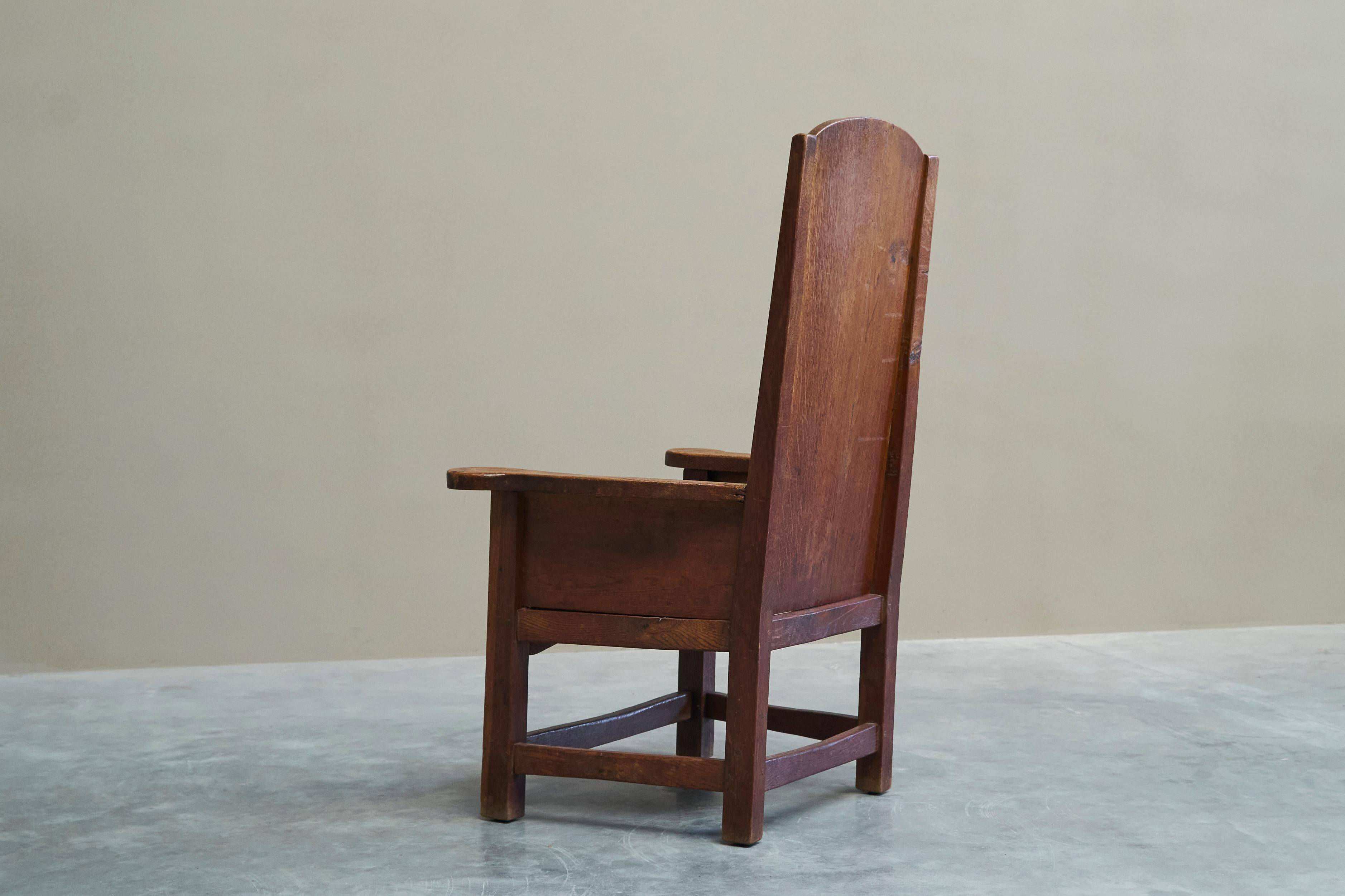 Antique solid oak armchair, 19th-century farmer style.