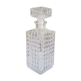 A square glass whiskey decanter