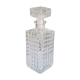 A square glass whiskey decanter