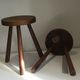 Pair of brutalist wooden tripod stools, France, 1960s